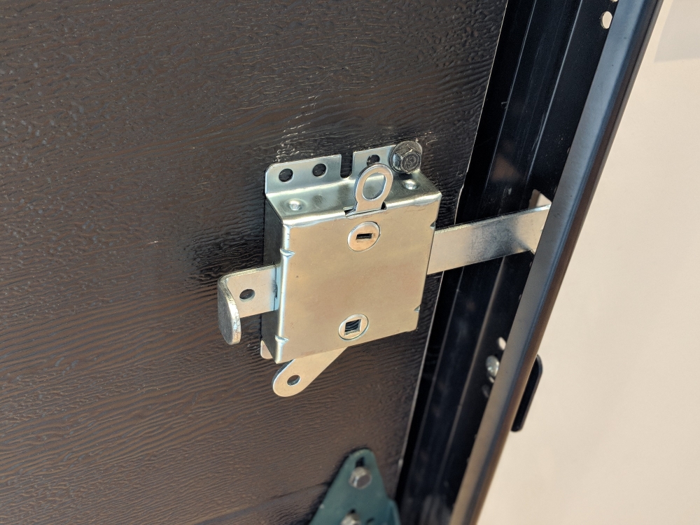 Garage Door Side Lock With Spring-Loaded Bolt
