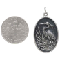 Sterling Silver Heron in Pond Pendant 30x16mm next to dime