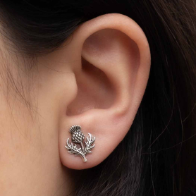 Sterling Silver Dimensional Thistle Post Earrings on ear