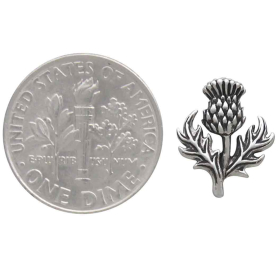 Sterling Silver Dimensional Thistle Post Earrings next to dime