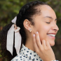 Silver Bow Post Earrings with Bronze Heart Dangle 18x14mm on model