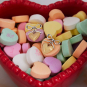 Bow and Heart earrings in candy dish