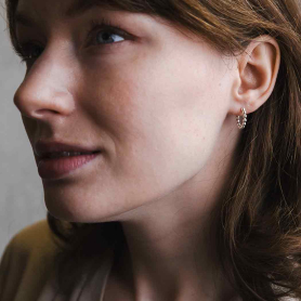 Sterling Silver Beaded Huggie Hoop Earrings on model