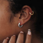 Sterling Silver Thick Round Huggie Hoop Earrings - on ear