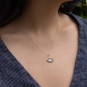 Sterling silver ginkgo necklace on neckl