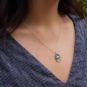 Sterling Silver UFO necklace on neck