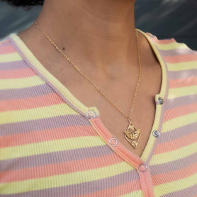 Bronze Geometric Moth necklace on neck