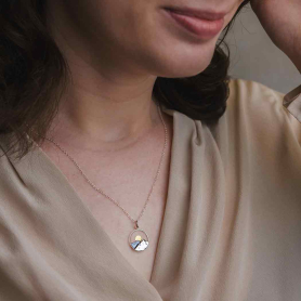 Sterling Silver 18 Inch Mountain Necklace with Bronze Sun on model
