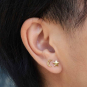 Solid 14K Gold star and moon post earrings on ear