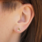 Solid 14K Gold cherry blossom post earrings on ear