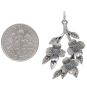 Sterling Silver Dogwood Flowers Pendant 32x18mm next to dime