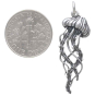 Sterling Silver Detailed Jellyfish Pendant 35x11mm next to dime