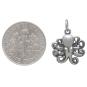 Sterling Silver Baby Octopus Charm 19x14mm next to dime