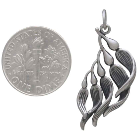 Sterling Silver Kelp Pendant 31x13mm next to dime