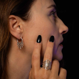 Sterling Silver Spiderweb Huggie Hoop Earrings on model