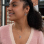 Sterling Silver Droopy Bow Dangle Earrings on model