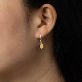 Mixed Metal Sun Dangle Earrings on model
