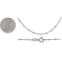 Sterling Silver Diamond Cut Station Chain next to dime