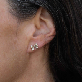 Bronze Bow Post Earrings 7x9mm on ear