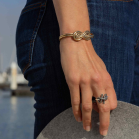 Bronze Figure 8 Knot Bracelet on hand