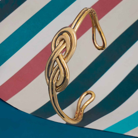 Bronze Knot Bracelet on striped background