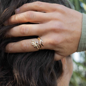 Bronze Adjustable Iris Ring - February Birth Flower on hand
