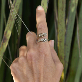 Bronze Mushroom and Fern Bypass Ring on hand