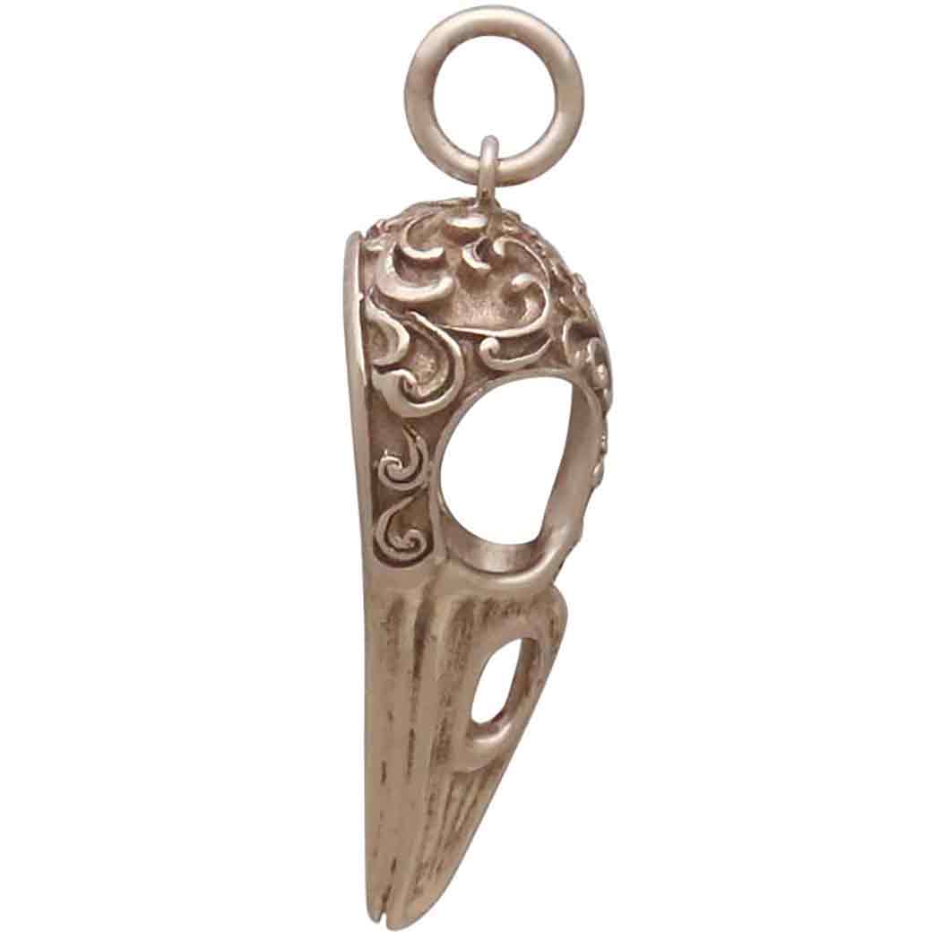 Bronze Raven Skull Charm with Scroll Carving 28x11mm