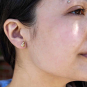 Bronze 3D Ghost Post Earrings 9x7mm on ear