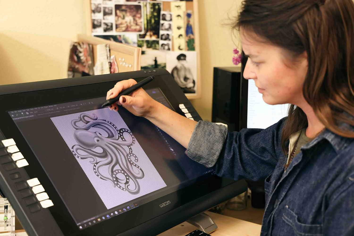 Marcy drawing octopus charm on computer