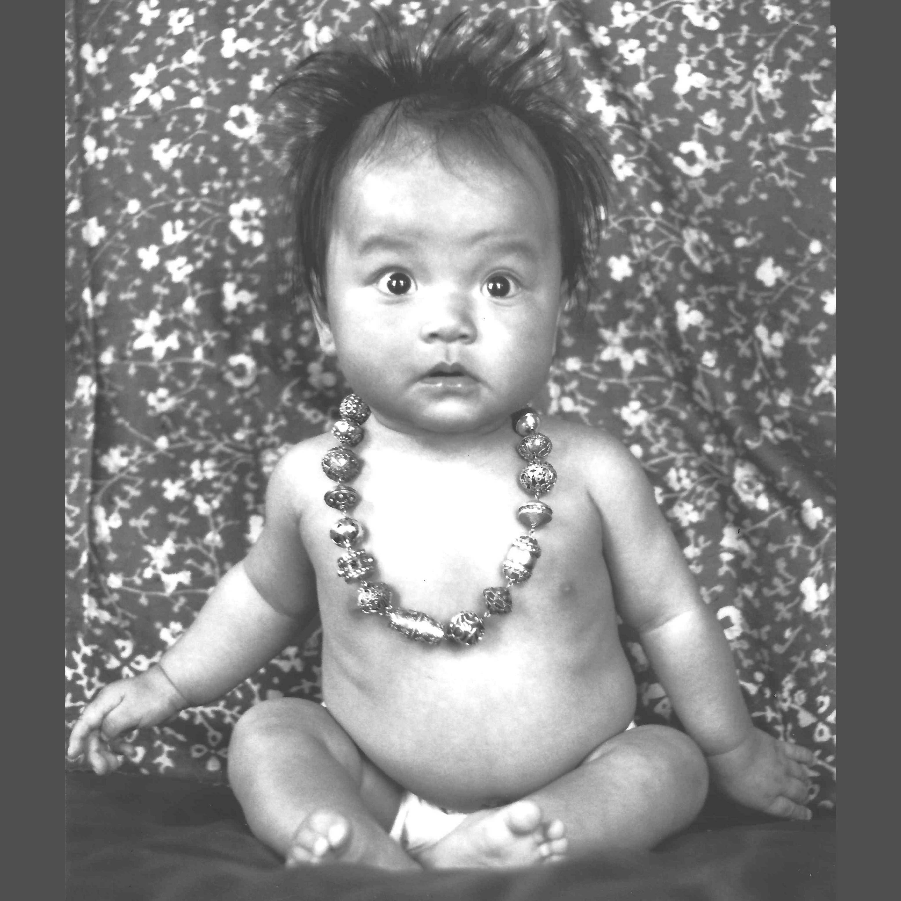 Baby Lyra wearing necklace with Bali Beads