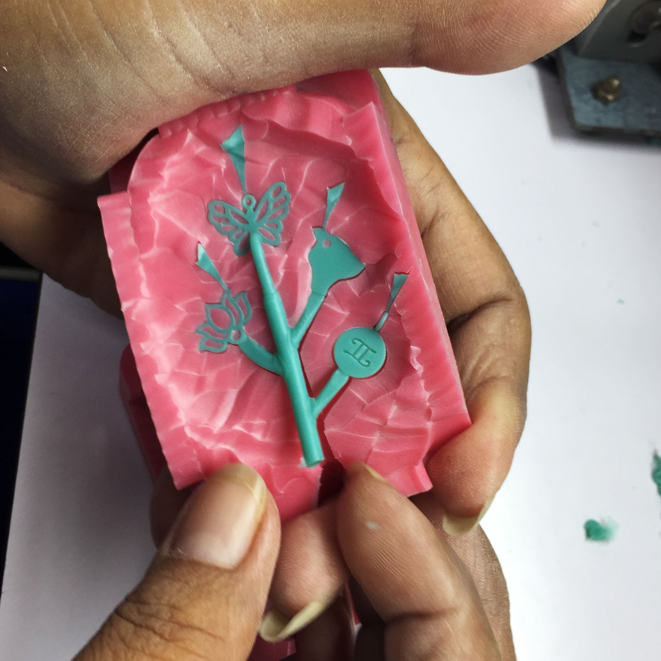 Wax Charms Being Removed from Mold