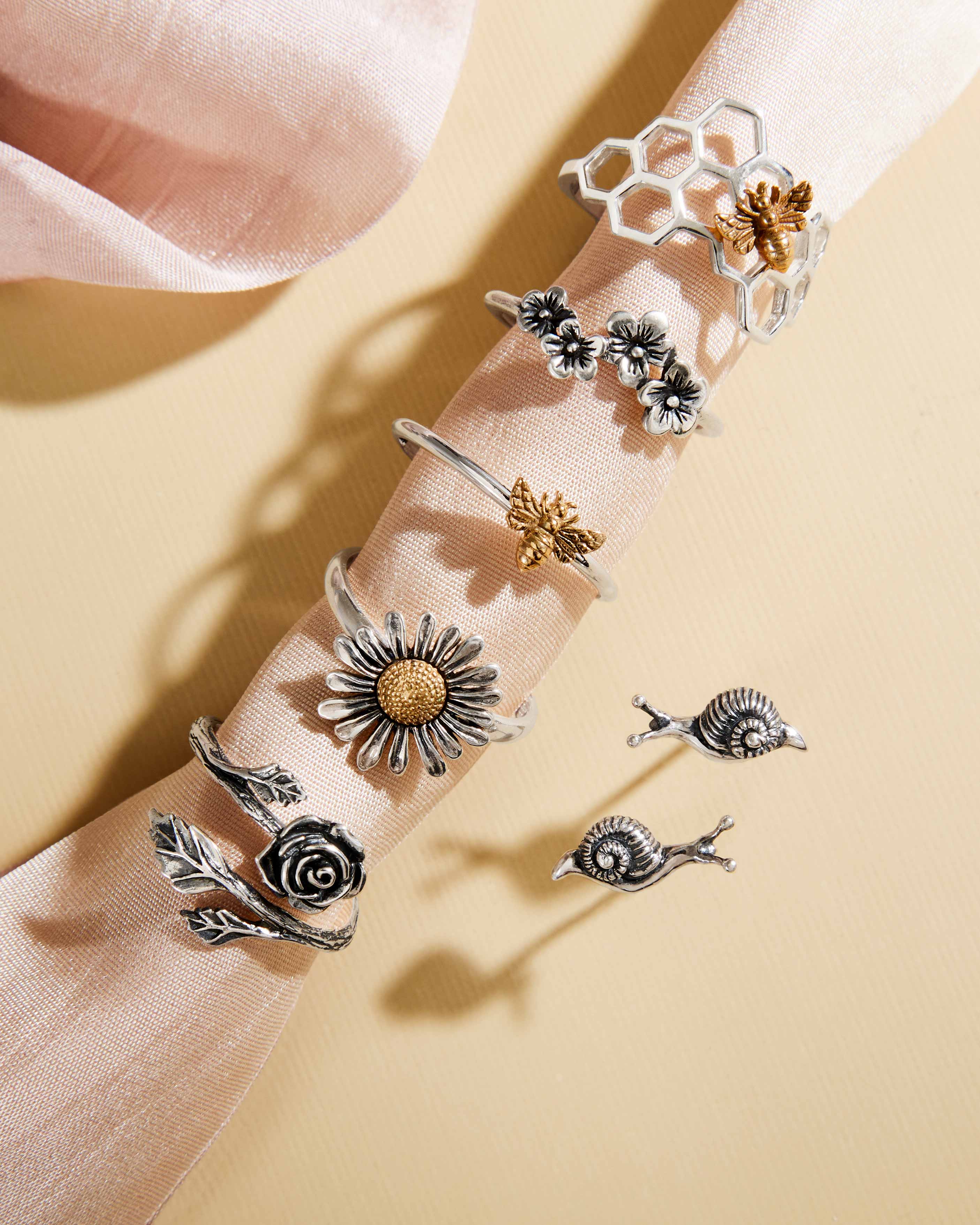 Collection of Bee Ring, Flower Rings and Earrings