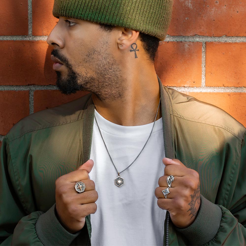 Man wearing mixed metal jewelry