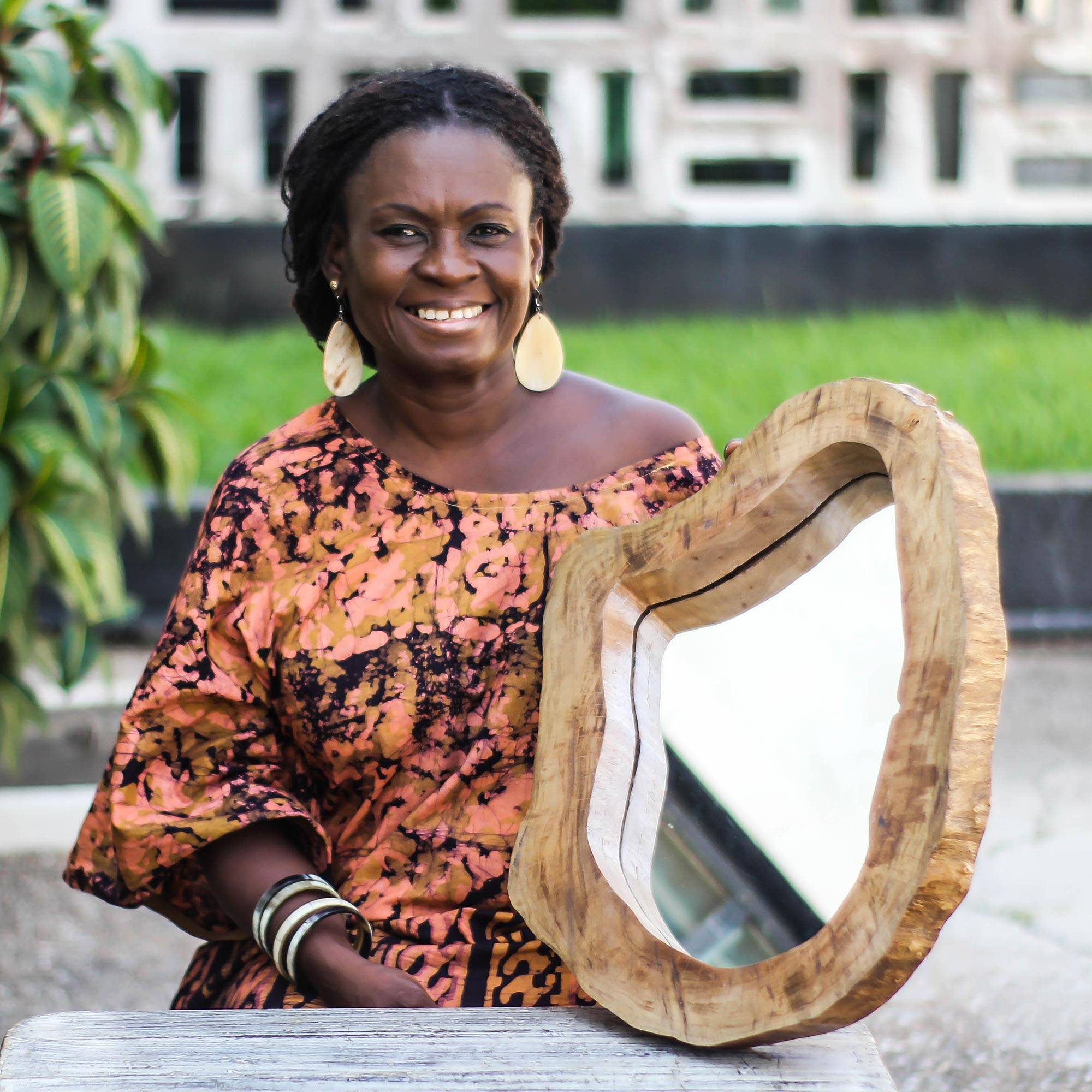 Woman with handmade mirror