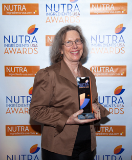 Beth Lambert, CEO with award image