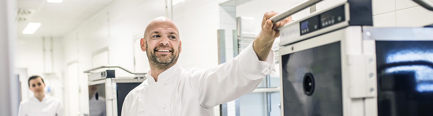 Chef moving the ScanBox unit in a kitchen environment