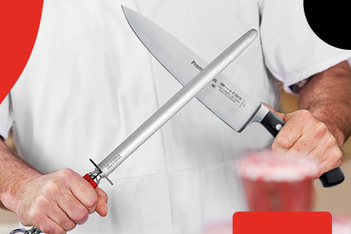 A butcher sharpening an F.DICK knife with an F.DICK sharpening steel